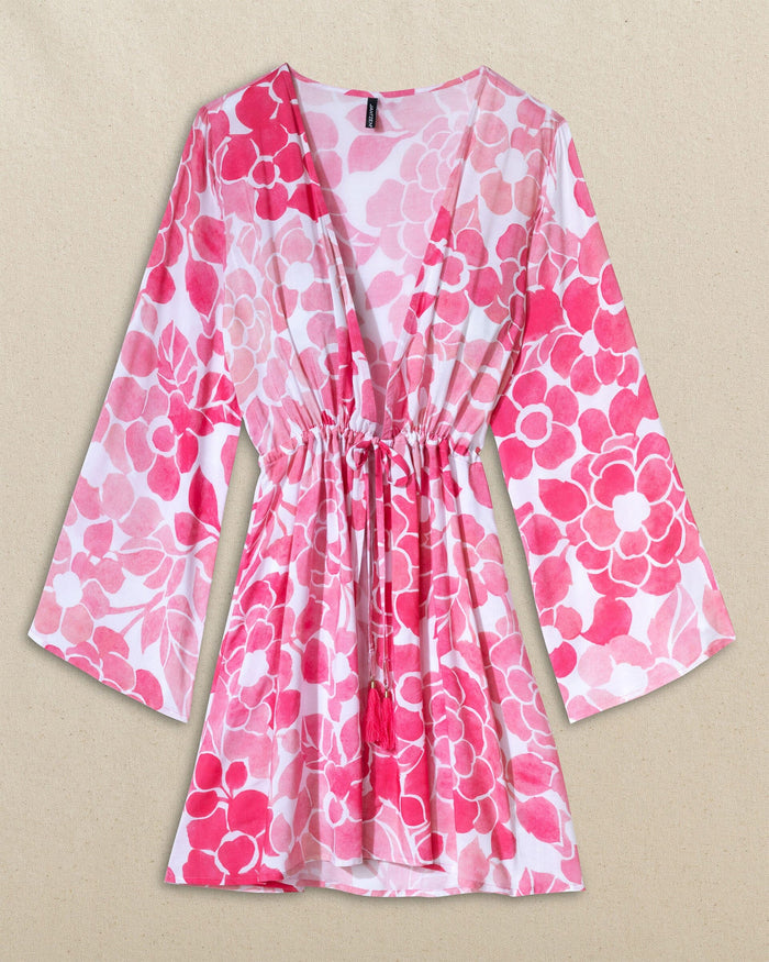 The front view of the Southern Tide Floral Bell Sleeve Short Tunic Cover-Up by Southern Tide - Island Pink