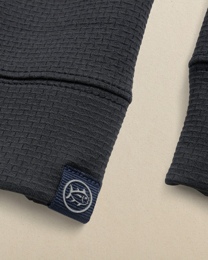 The detail view of the Southern Tide Georgia Bulldogs Oval G Schooner Quarter Zip by Southern Tide - Caviar Black