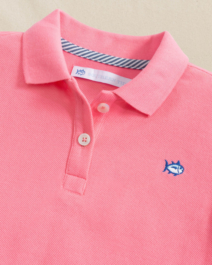 The detail view of the Southern Tide Girls Skipjack Dropwaist Polo Dress by Southern Tide - Sea Pink