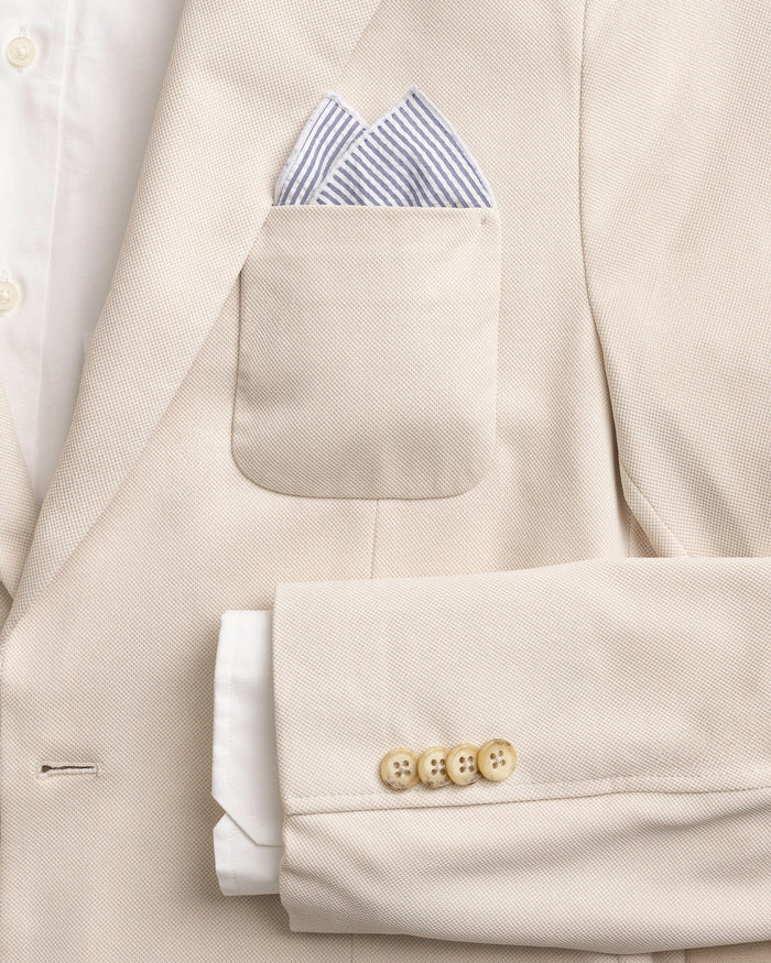 The detail coat view of the Southern Tide Blue and White Seersucker Pocket Square by Southern Tide - Blue