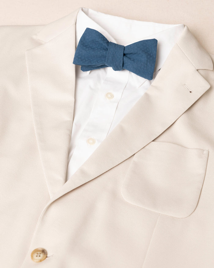 The detail coat view of the Southern Tide Nautical Blue Seersucker Bow Tie by Southern Tide - Nautical Blue