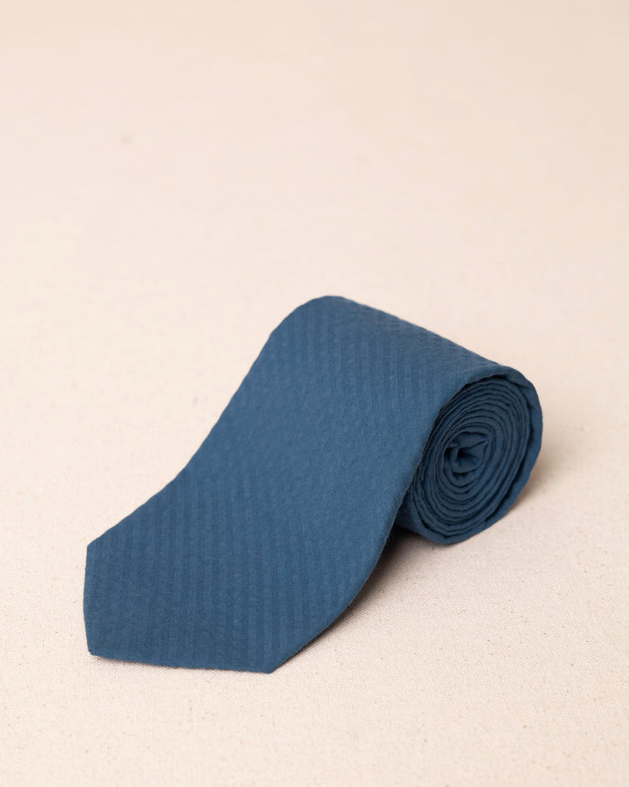 The front rolled view of the Southern Tide Nautical Blue Seersucker Necktie by Southern Tide - Nautical Blue
