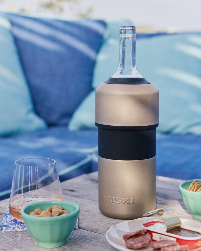 The lifestyle view of the Huski Wine Chiller at Southern Tide - Champagne