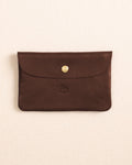 The front view of the Il Bisonte Leather Envelope Pouch at Southern Tide - Coffee