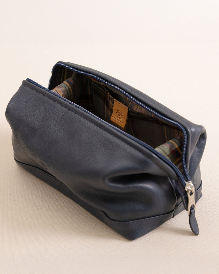 The side view of the Il Bisonte Travel Bag at Southern Tide - Blue Mezzanotte