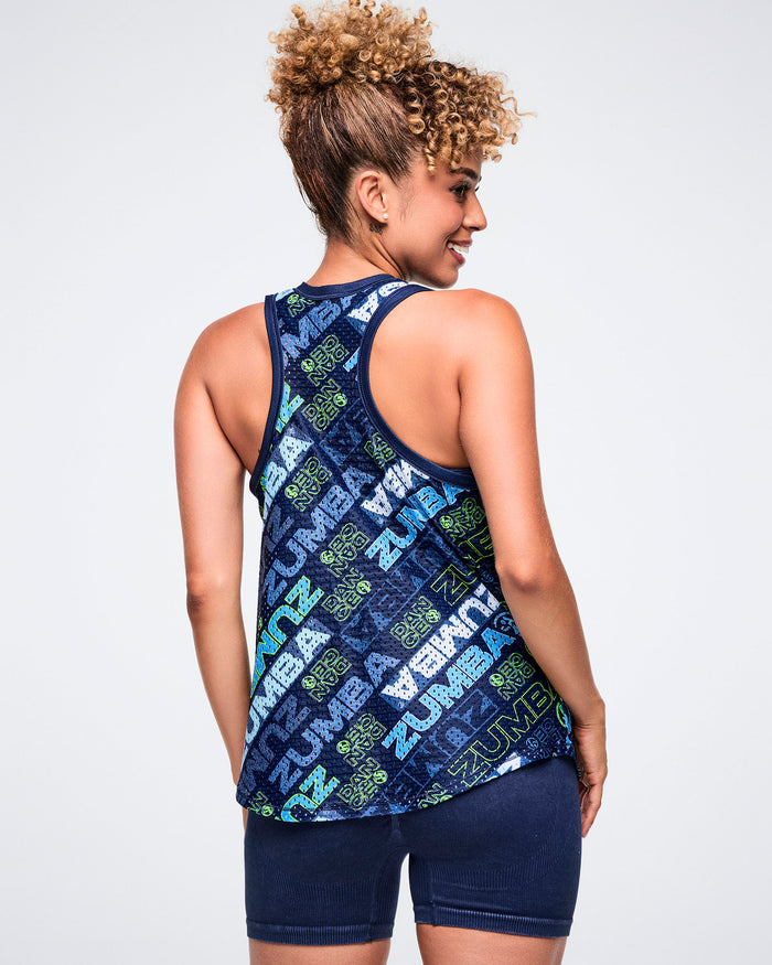 Back view of a female model wearing a patterned mesh basketball tank top and blue shorts.