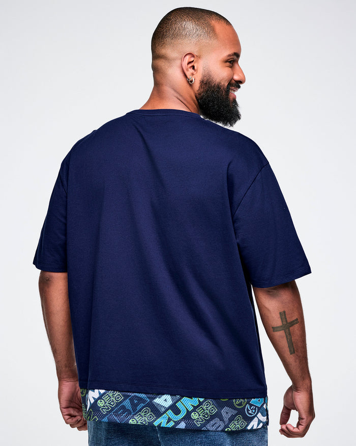 Back view of a male model wearing a blue 'Zumba' t-shirt.