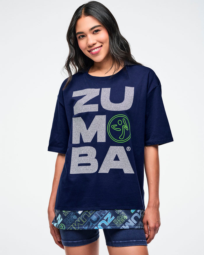 Close view of a female model wearing a blue "Zumba" shirt.