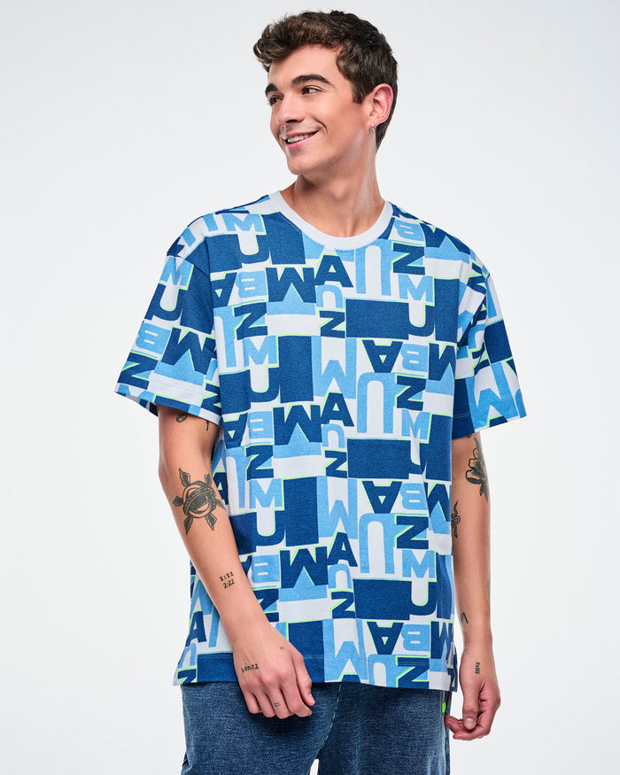 Male model wearing a blue and white patterned top on a plain background.