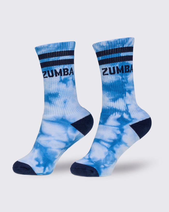 Blue and white tie-dye socks with dark blue accents and 'Zumba' branding on a light gray background.