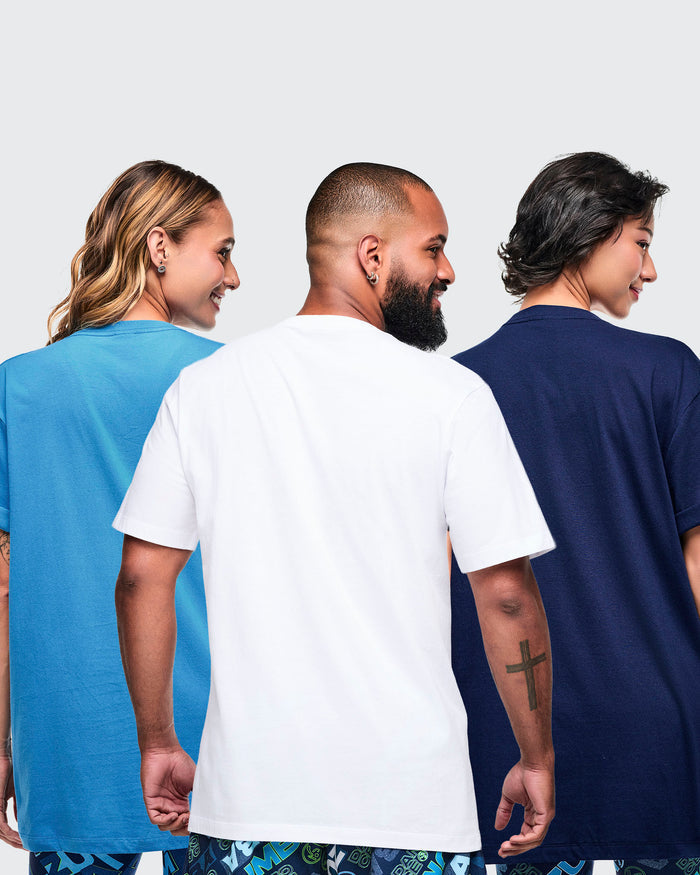 Back view of three models wearing light blue, white, and dark blue Zumba T-shirts from a 12-pack.
