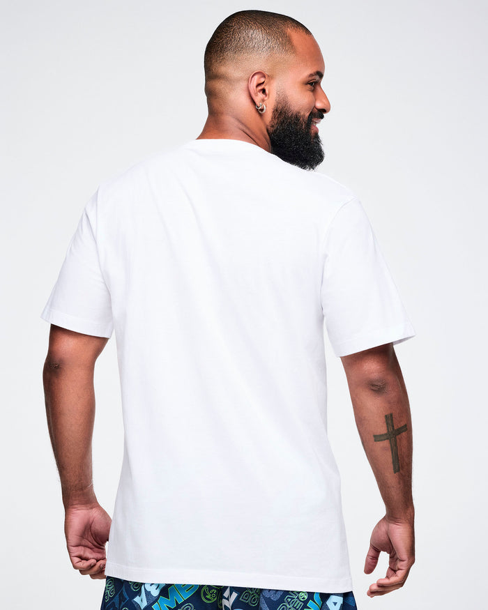 Back view of a male model wearing a white Zumba t-shirt on a plain background.
