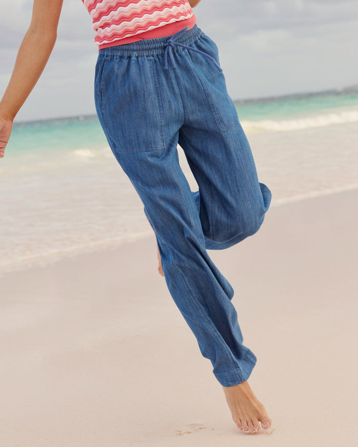 The lifestyle view of the Southern Tide Laken Denim Wide Leg Pant by Southern Tide - Medium Wash Indigo