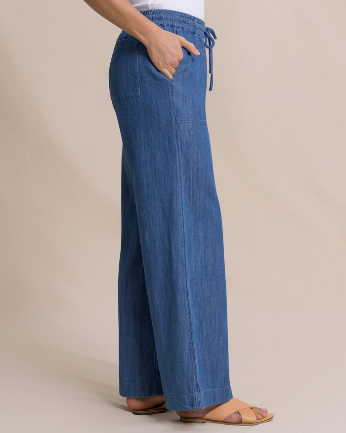 The side view of the Southern Tide Laken Denim Wide Leg Pant by Southern Tide - Medium Wash Indigo