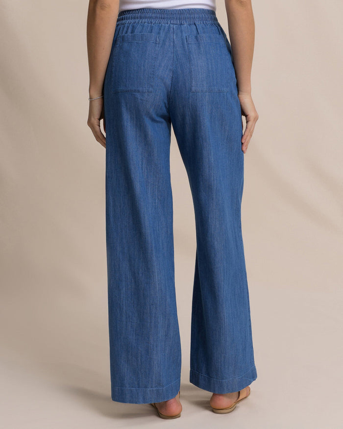 The back view of the Southern Tide Laken Denim Wide Leg Pant by Southern Tide - Medium Wash Indigo