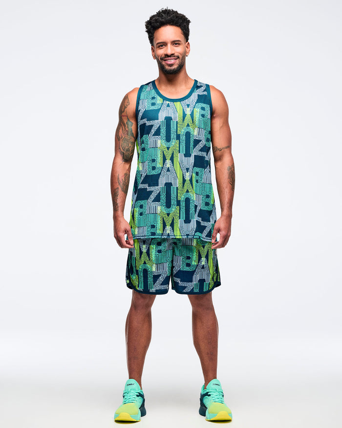 Teal, navy, and lime graphic-print mesh tank top paired with matching printed shorts, modeled by a male wearing teal-to-lime athletic sneakers on a white studio background.