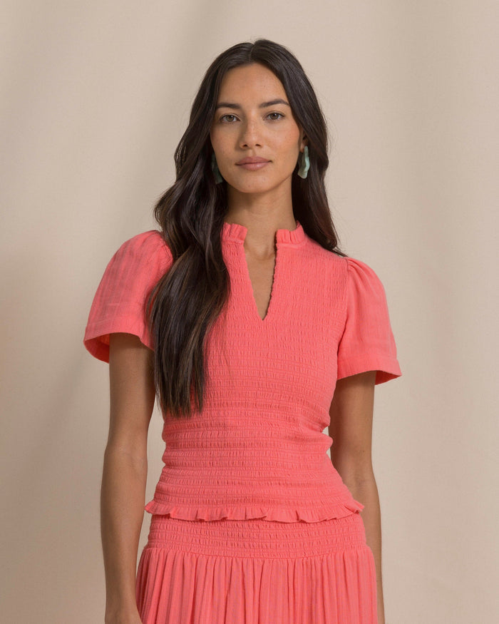 The front view of the Southern Tide Lola Smocked Bodice Top by Southern Tide - Coral Beach