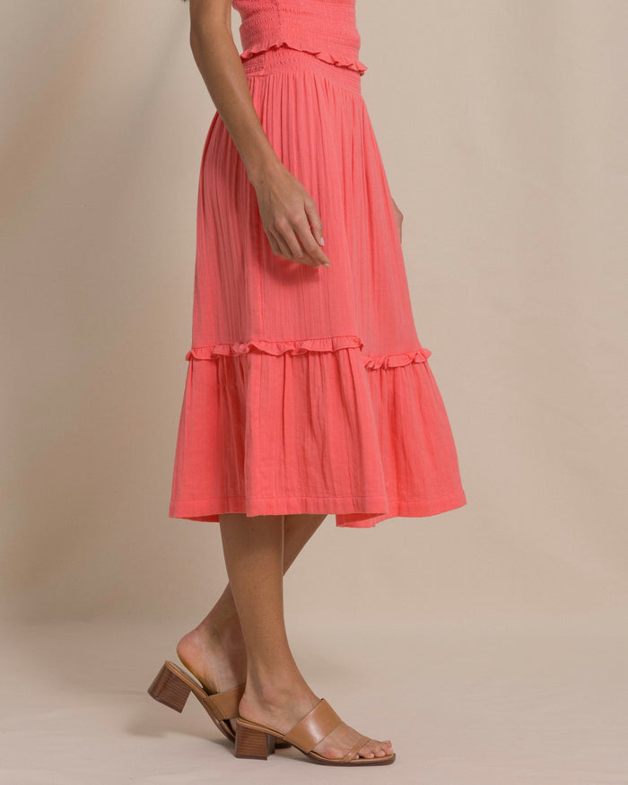 The side view of the Southern Tide Lydia Smocked Waist Midi Skirt by Southern Tide - Coral Beach