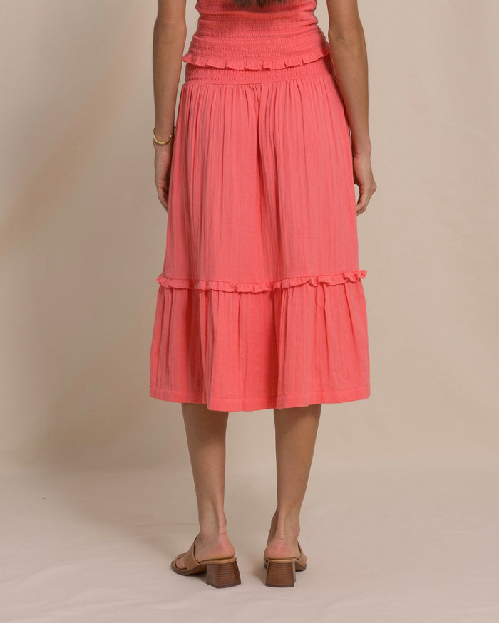 The back view of the Southern Tide Lydia Smocked Waist Midi Skirt by Southern Tide - Coral Beach