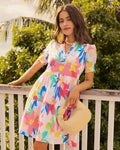 The lifestyle view of the Southern Tide Mina Floral Print Dress by Southern Tide - Classic White