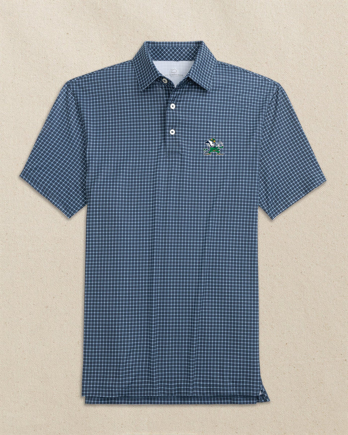 The front view of the Southern Tide Notre Dame Leprechaun Driver Dunes Edge Plaid Polo by Southern Tide - Navy