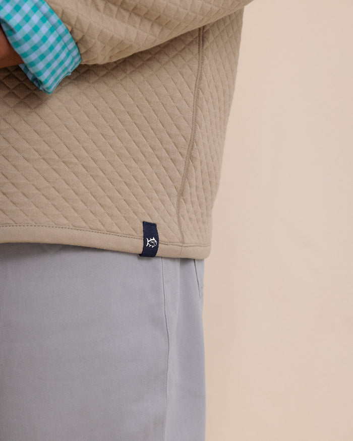 The detail view of the Southern Tide Oak Island Reversible Quarter Zip by Southern Tide - Sandstone Khaki