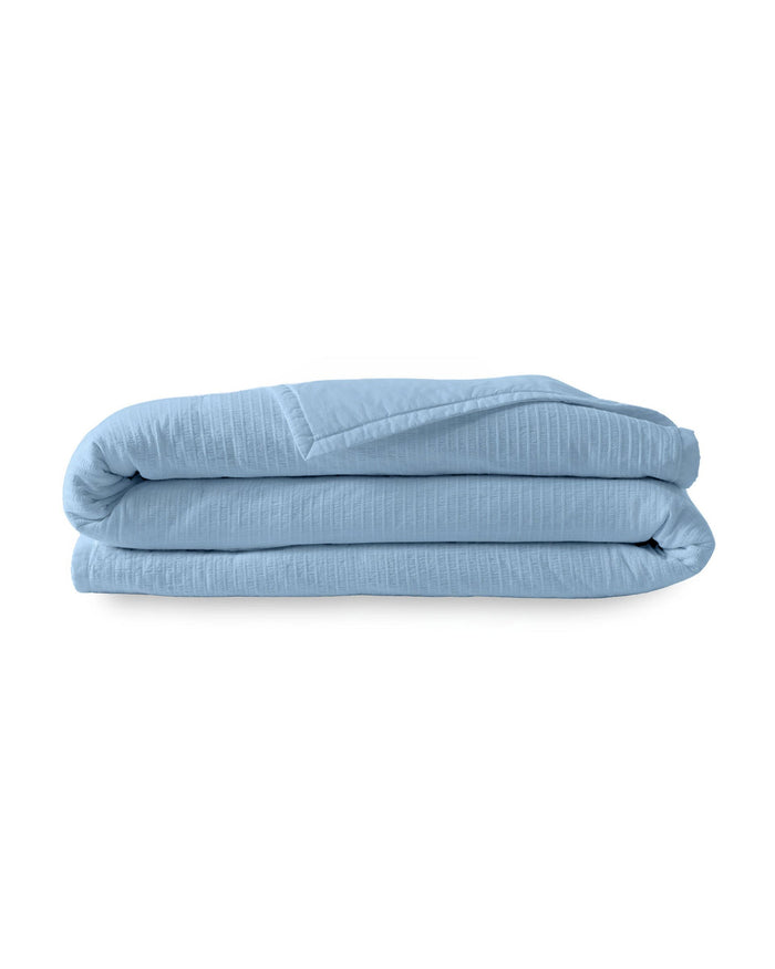 The front view of the Southern Tide Ocean Isle Peri Quilt by Southern Tide - Peri