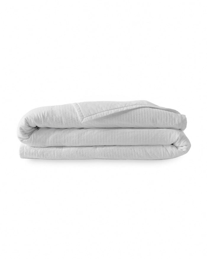 The front view of the Southern Tide Ocean Isle White Quilt by Southern Tide - White