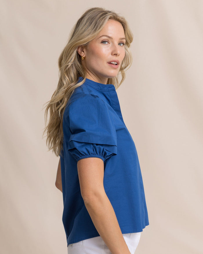 The side view of the Southern Tide Payge Solid Poplin Top by Southern Tide - Nautical Blue