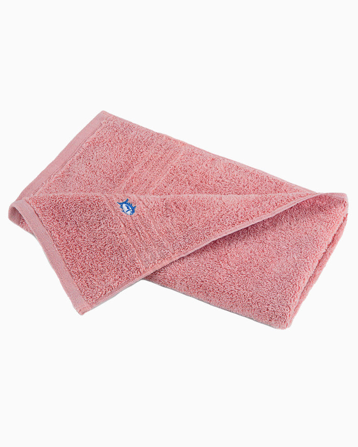The front view of the Performance 5.0 Hand Towel by Southern Tide - Geranium Pink - Hand Towel