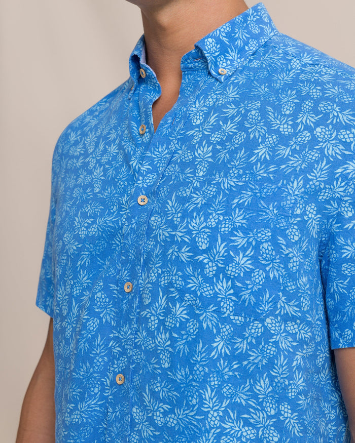 The detail view of the Southern Tide Pineapple Parade Linen Rayon Short Sleeve Sport Shirt by Southern Tide - Blue Stream