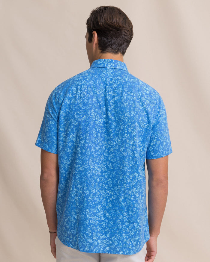 The back view of the Southern Tide Pineapple Parade Linen Rayon Short Sleeve Sport Shirt by Southern Tide - Blue Stream