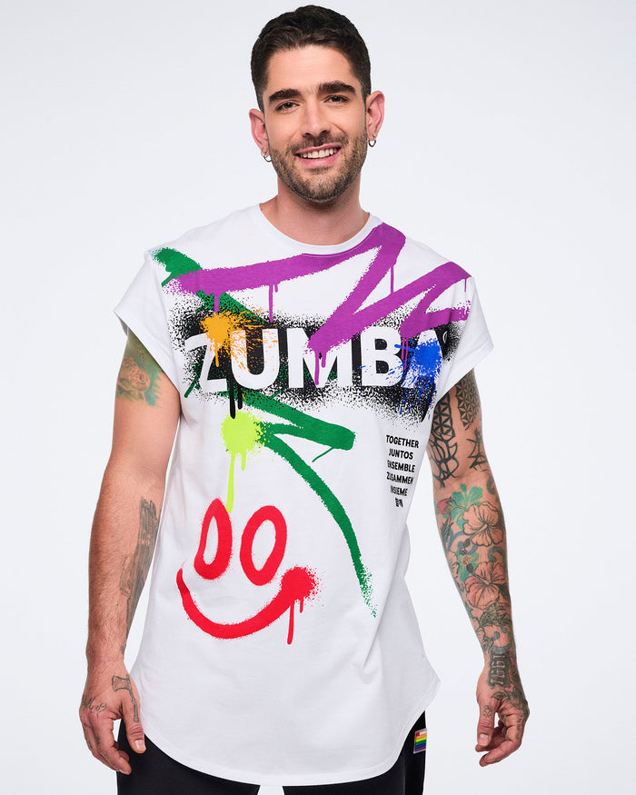 Male model wearing a colorful 'Zumba' t-shirt on a white background.