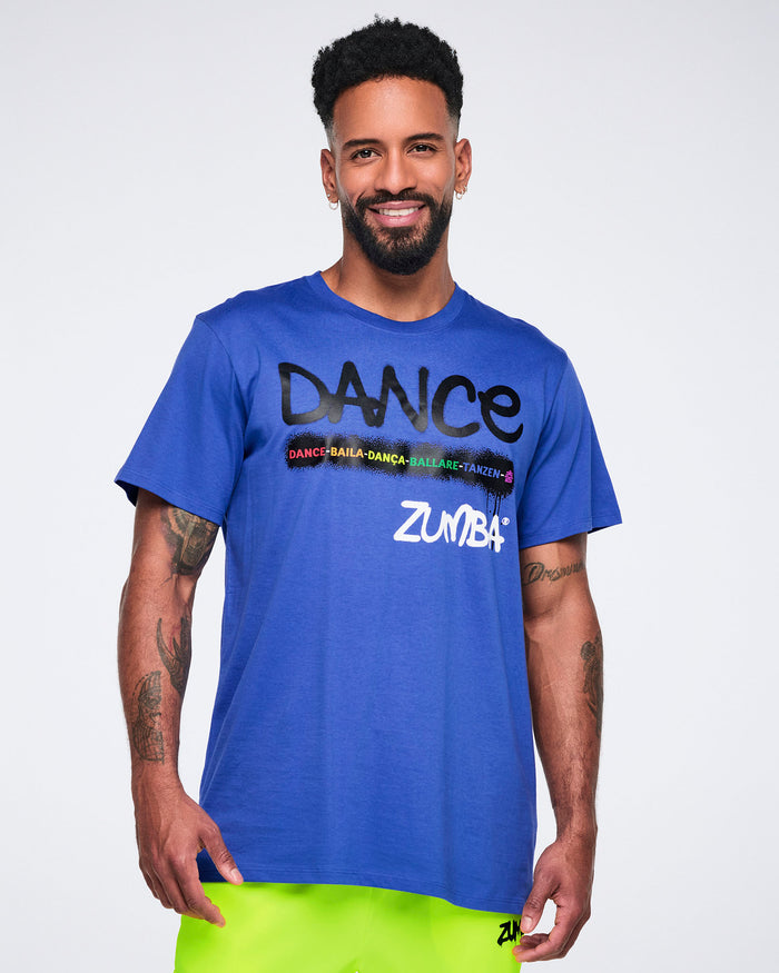 Male model wearing a blue Zumba t-shirt with colorful text on a white background.