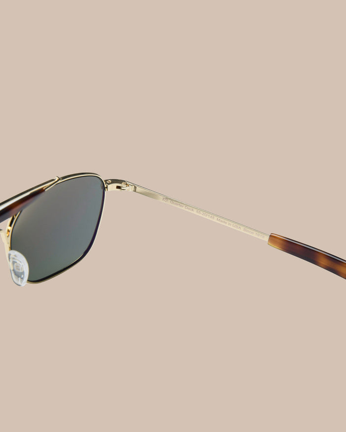 The left detail view of the Southern Tide Quarter Deck Aviator by Southern Tide - Yellow Gold Frame with American Green Lens