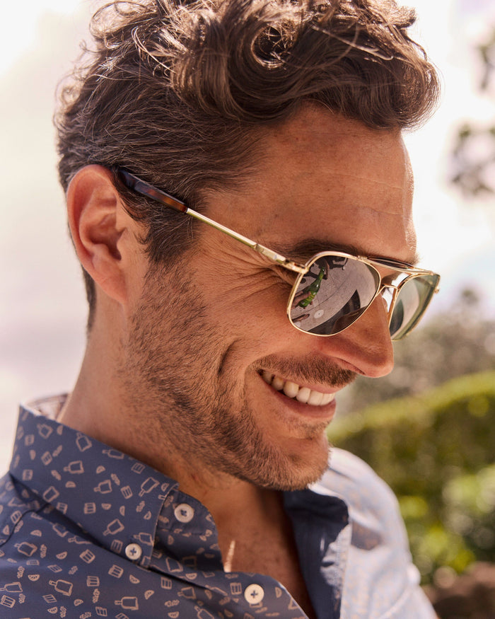 The lifestyle view of the Southern Tide Quarter Deck Aviator by Southern Tide - Yellow Gold Frame with American Green Lens