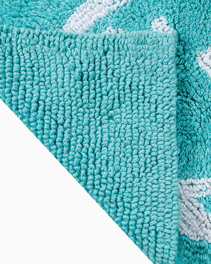 The flip view of the Reversible Skipjack Bath Rug by Southern Tide - Aqua