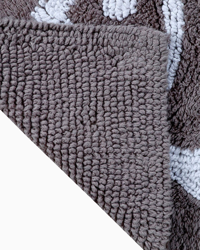 The flip view of the Reversible Skipjack Bath Rug by Southern Tide - Grey Harpoon