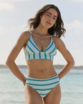 The front lifestyle view of the Southern Tide Reversible Tropical Stripe Banded Bikini Top by Southern Tide - Florida Keys