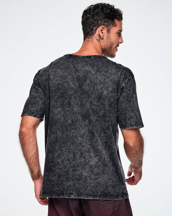 A male model wearing a dark gray acid-wash tee, shown from the back against a plain white studio background.