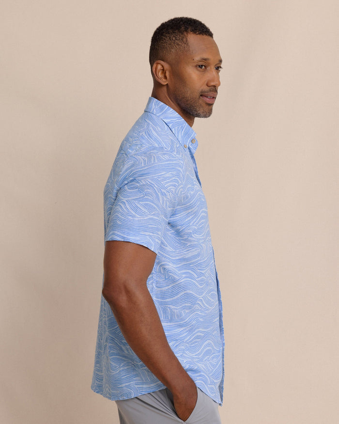 The side view of the Southern Tide Rolling Waves Linen Rayon Short Sleeve Sport Shirt by Southern Tide - Cerulean