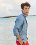 The lifestyle view of the Southern Tide Sandy Beach Chambray Sport Shirt by Southern Tide - Blue Chambray