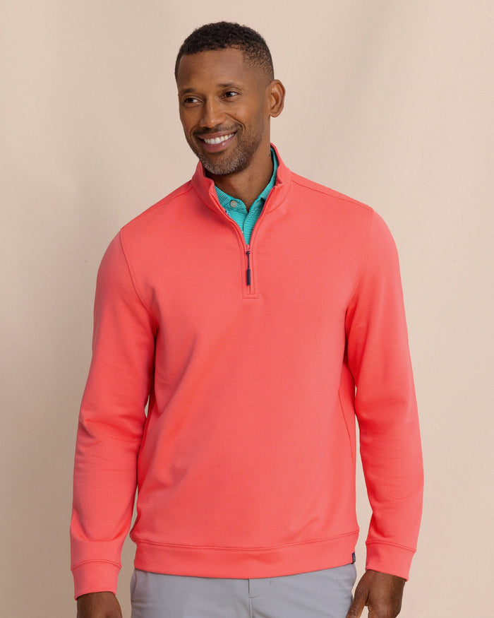 The front view of the Southern Tide Schooner Quarter Zip by Southern Tide - Sunkist Coral