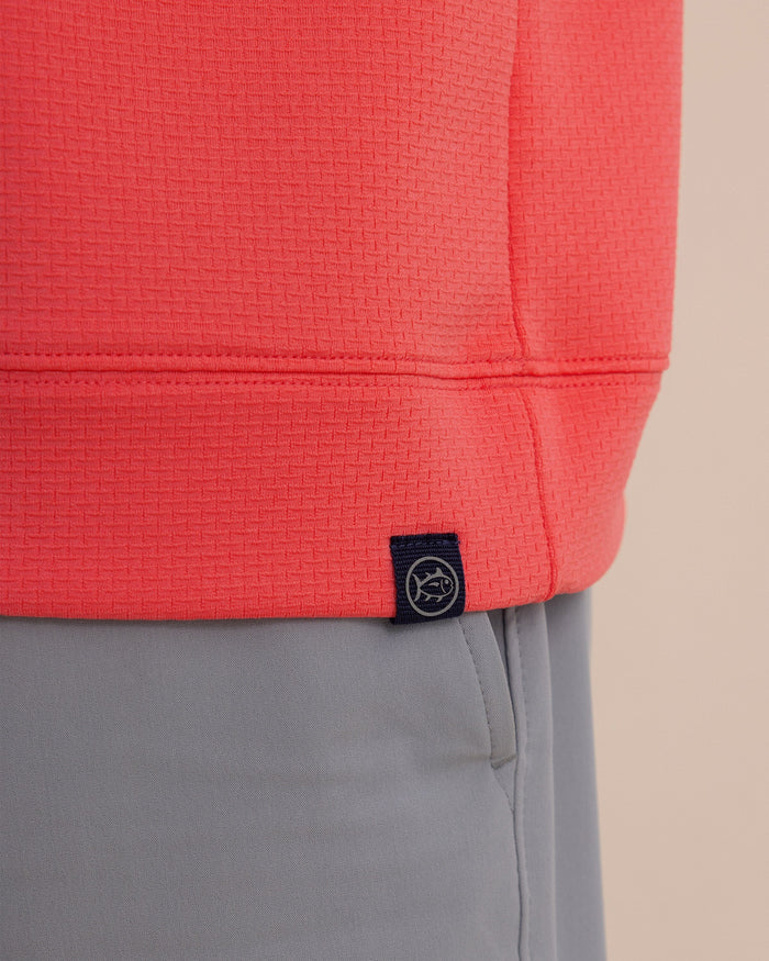 The detail view of the Southern Tide Schooner Quarter Zip by Southern Tide - Sunkist Coral