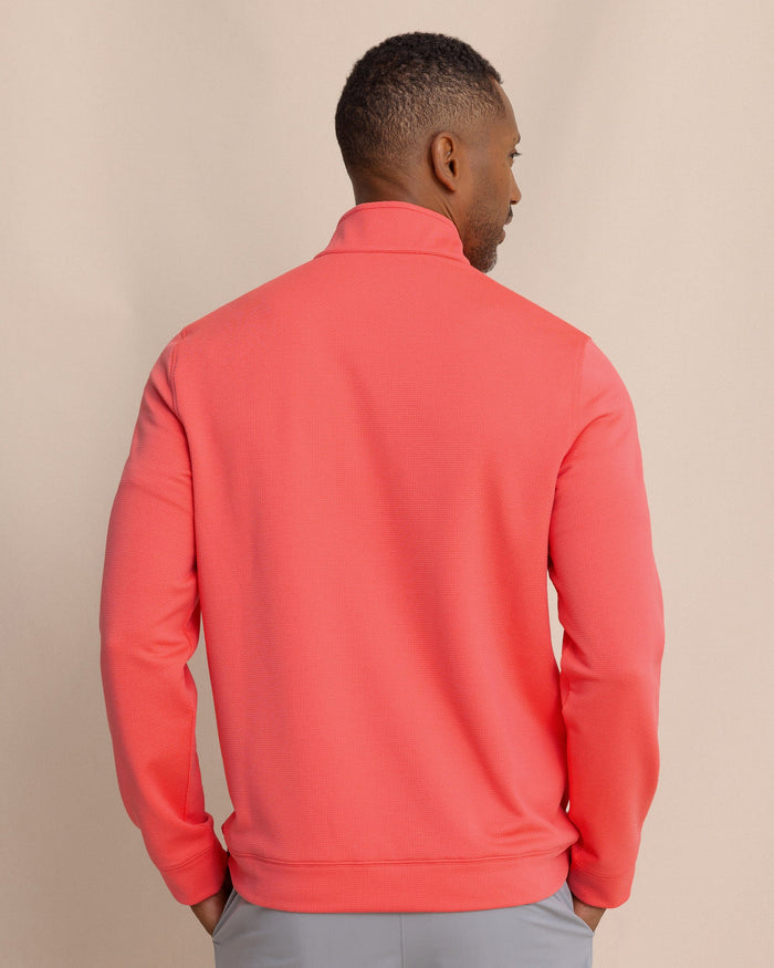 The back view of the Southern Tide Schooner Quarter Zip by Southern Tide - Sunkist Coral