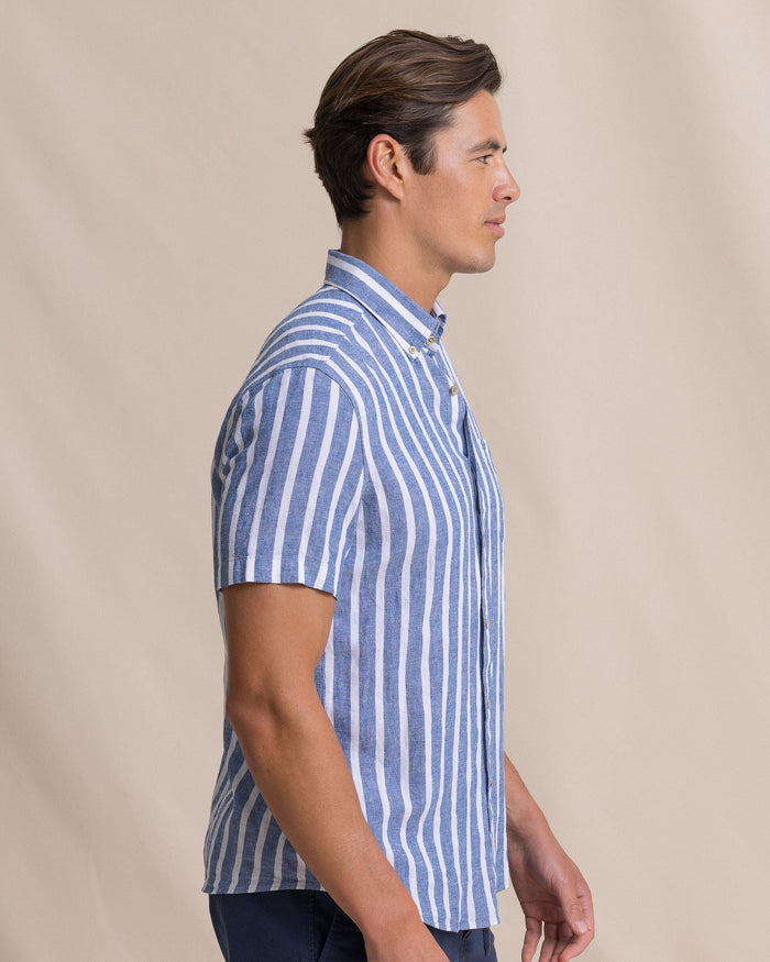 The side view of the Southern Tide Seamark Stripe Linen Rayon Short Sleeve Sport Shirt by Southern Tide - Nautical Blue