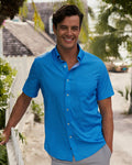 The lifestyle view of the Southern Tide Seaside Geo Coastal Breeze® Short Sleeve Sport Shirt by Southern Tide - Blue Stream