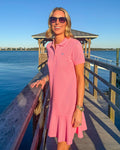 The lifestyle view of the Southern Tide Skipjack Dropwaist Polo Dress by Southern Tide - Sea Pink
