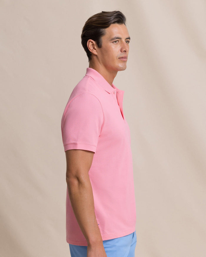 The side view of the Southern Tide Skipjack Polo Shirt by Southern Tide - Sea Pink