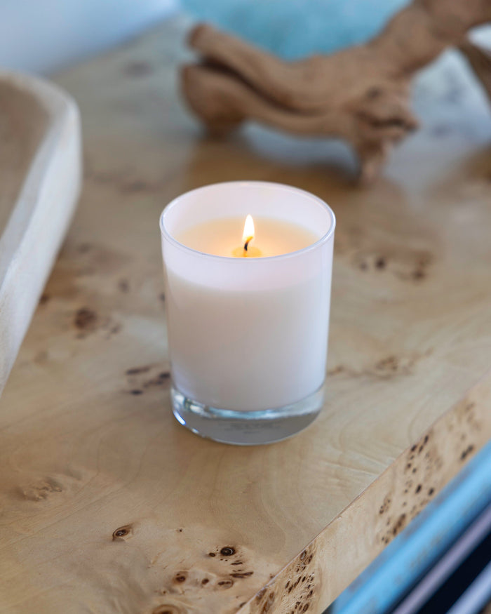 The lifestyle view of the Southern Tide Blue Scented Candle by Southern Tide - Blue